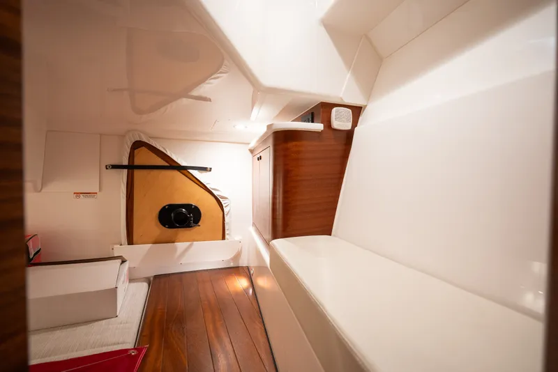 Slide: The Image of Interior cabin of 2025 Pursuit OS 405 Offshore boat with wooden flooring. - 68