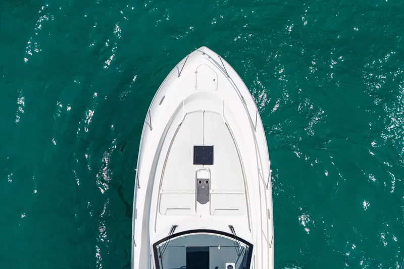 Slide: The Image of Aerial view of 2025 Pursuit OS 405 Offshore boat on turquoise water. - 6