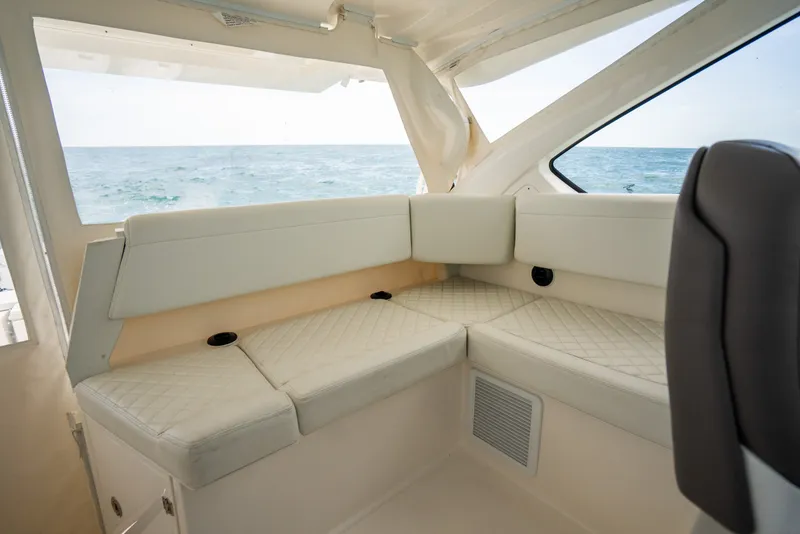 Slide: The Image of Interior seating of 2025 Pursuit OS 405 Offshore boat with ocean view. - 37