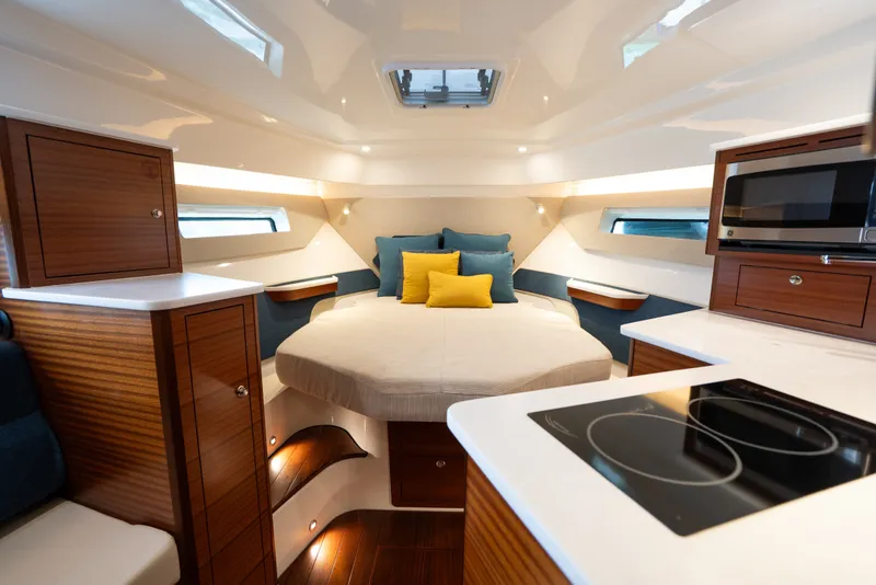 Slide: The Image of Luxurious interior of 2025 Pursuit OS 405 Offshore boat with cozy bed and modern amenities. - 51