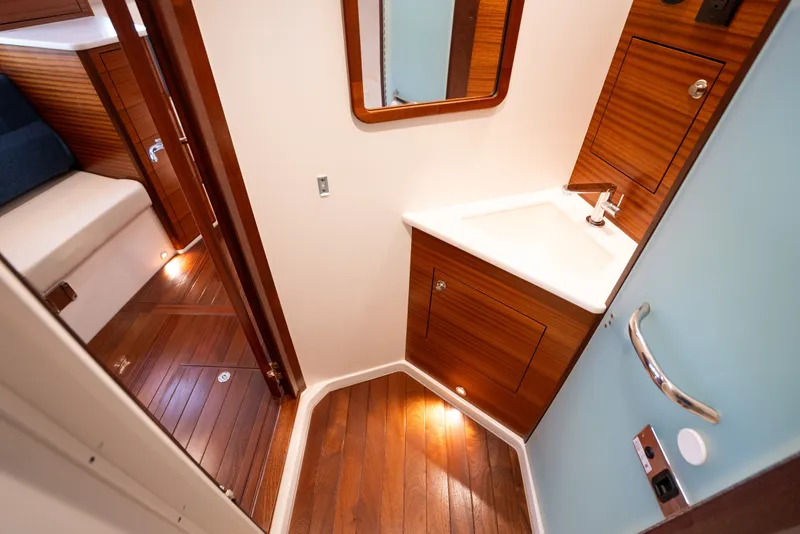 Slide: The Image of Luxurious 2025 Pursuit OS 405 Offshore yacht bathroom with wooden accents and modern fixtures. - 65