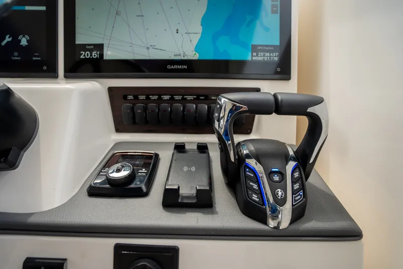 Slide: The Image of Control panel of 2025 Pursuit OS 405 Offshore boat with Garmin navigation display. - 43