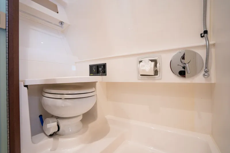 Slide: The Image of 2025 Pursuit OS 405 Offshore yacht bathroom with modern fixtures and compact design. - 63