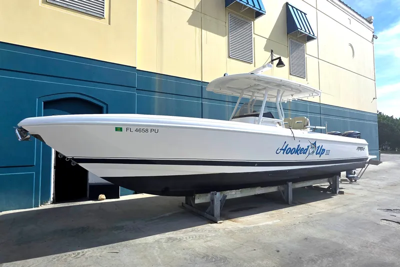 Slide: The Image of 2015 Intrepid 327 Center Console boat on display, labeled "Hooked Up III." - 5