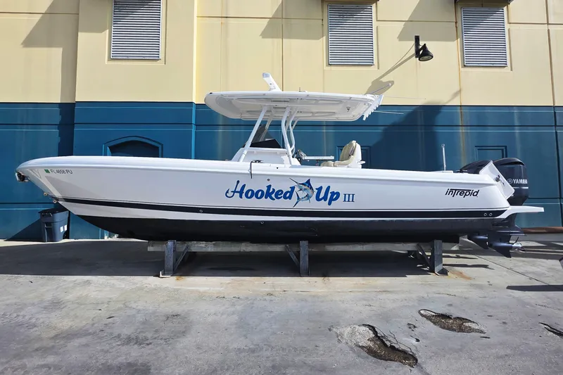 Slide: The Image of 2015 Intrepid 327 Center Console boat on display, labeled "Hooked Up III." - 1