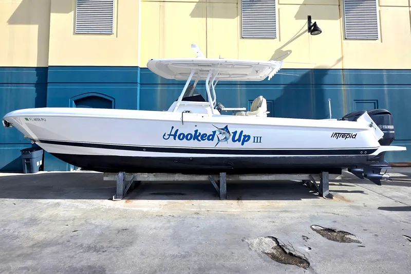 Slide: The Image of 2015 Intrepid 327 Center Console boat on display, named "Hooked Up III." - 0