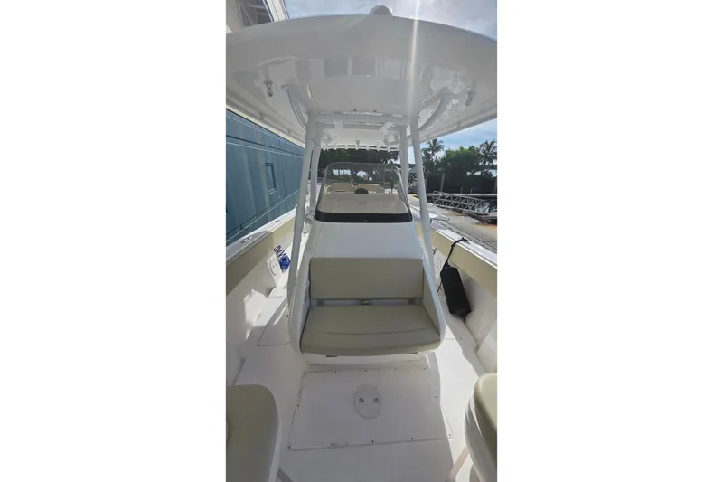 Slide: The Image of 2015 Intrepid 327 Center Console boat interior with seating and console view. - 20