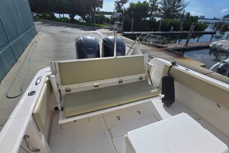 Slide: The Image of 2015 Intrepid 327 Center Console boat with dual engines docked at marina. - 29