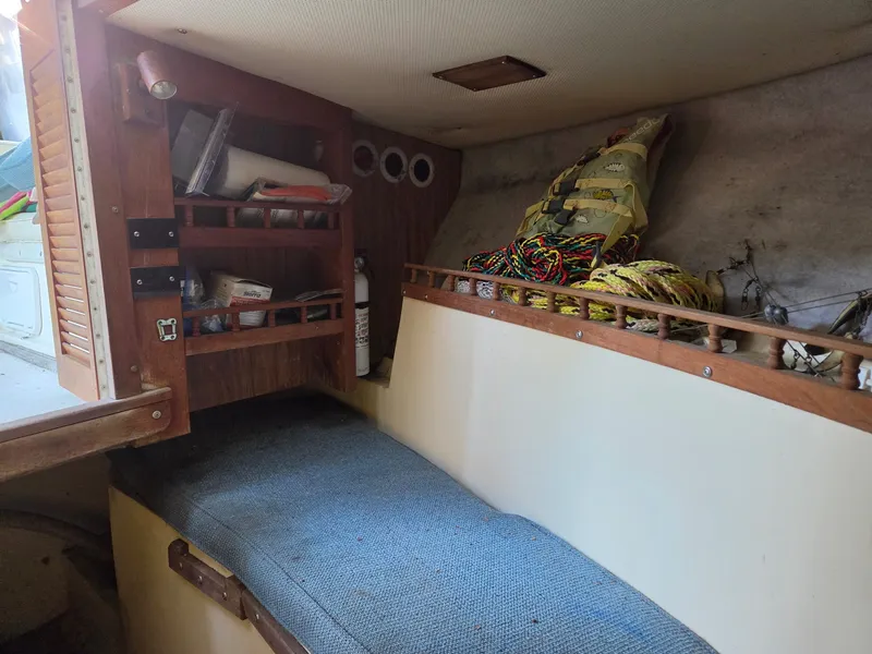 Slide: The Image of Interior of a 1989 Mako 286 with storage and seating area. - 5