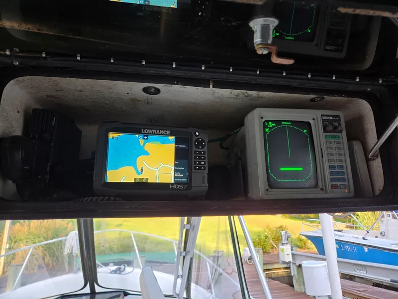 Slide: The Image of The image shows the helm of a 1989 Mako 286 with navigation equipment. - 3