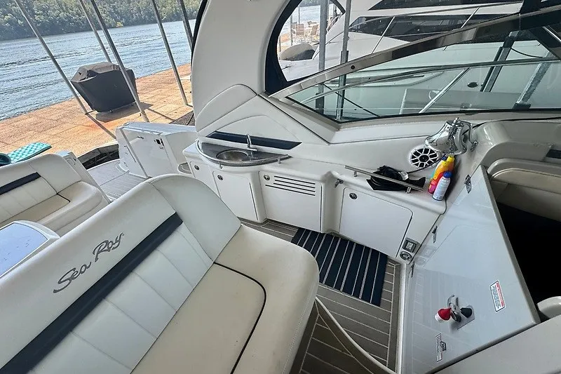 Slide: The Image of Interior view of 2005 Sea Ray 390 Sundancer yacht with seating and kitchenette. - 25