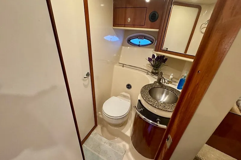 Slide: The Image of Luxurious bathroom in 2005 Sea Ray 390 Sundancer yacht with modern amenities. - 16