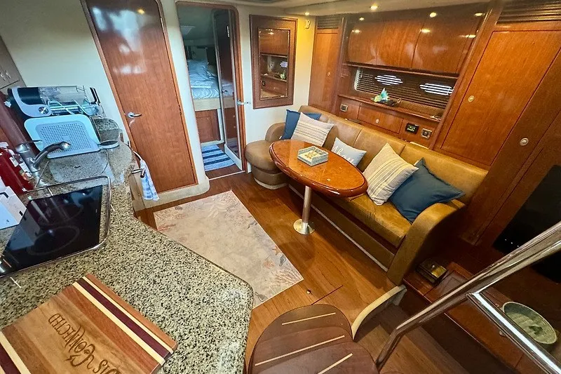 Slide: The Image of Luxurious interior of 2005 Sea Ray 390 Sundancer yacht with cozy seating and modern amenities. - 7