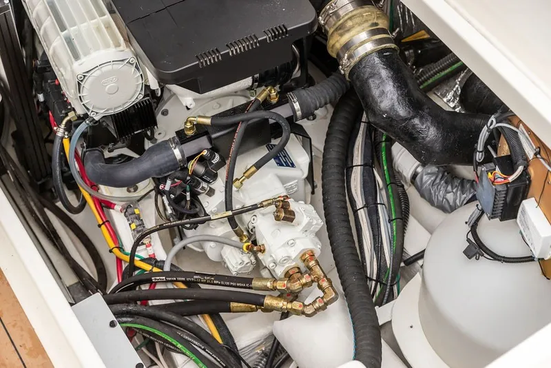 Slide: The Image of Engine compartment of 2026 Hinckley Picnic Boat 39, showcasing intricate mechanical components. - 37