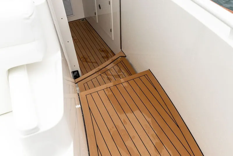 Slide: The Image of Teak deck of 2026 Hinckley Picnic Boat 39, showcasing elegant craftsmanship. - 21