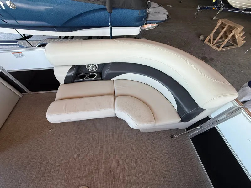 Slide: The Image of The seating on the 2017 Starcraft EX 20 C is cream-colored with black accents. - 8