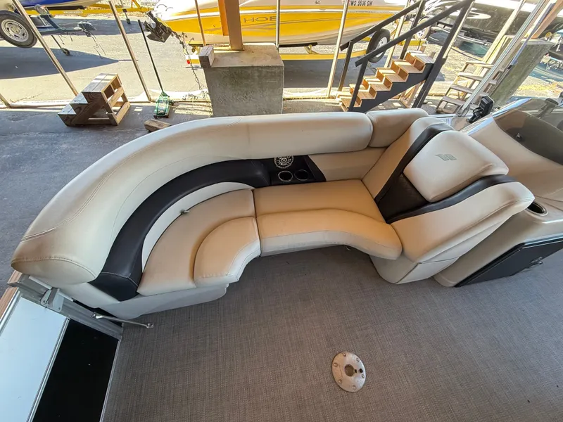 Slide: The Image of Interior view of a 2017 Starcraft EX 20 C with beige and black upholstered seating. - 7