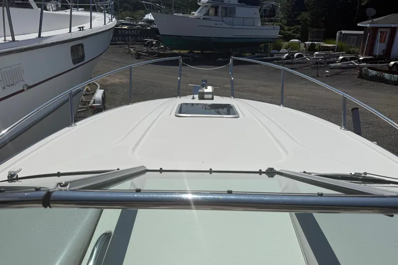 Slide: The Image of 2007 Chaparral 275 SSi boat deck view in a marina setting. - 12