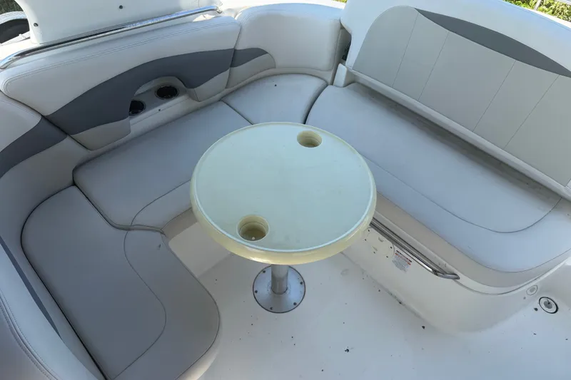 Slide: The Image of Interior seating area of a 2007 Chaparral 275 SSi boat with a round table. - 8