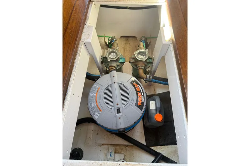 Slide: The Image of Bilge compartment of 1970 Prowler 32 Forest Johnson boat with pump and hoses. - 16