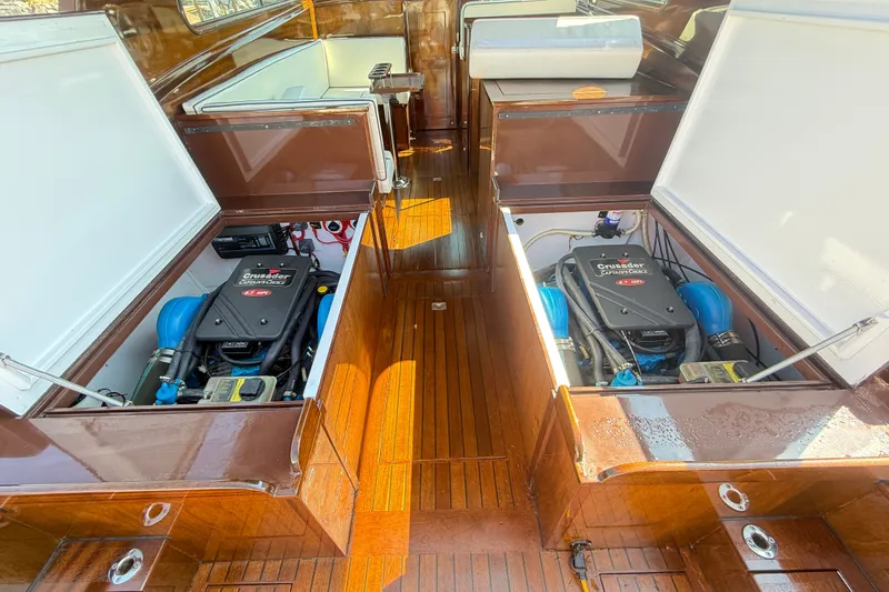 Slide: The Image of 1970 Prowler 32 Forest Johnson boat engine compartment with Crusader engines, wooden deck. - 20