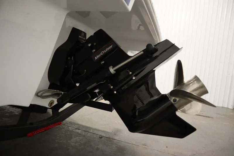 Slide: The Image of 2026 Four Winns H1 boat with MerCruiser outdrive and propeller in a garage. - 39