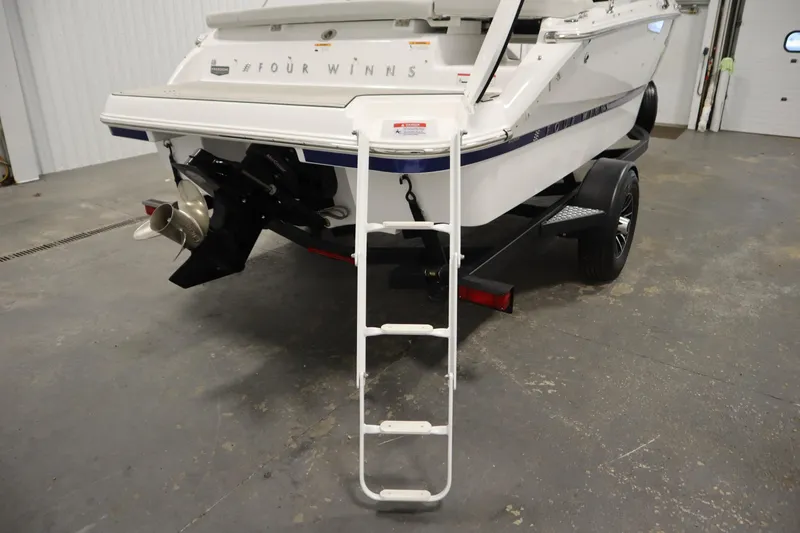 Slide: The Image of Rear view of 2026 Four Winns H1 boat with ladder. - 38