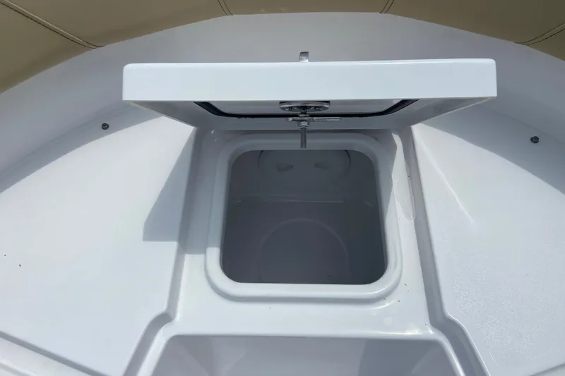 Slide: The Image of Open storage compartment on 2027 Sportsman Heritage 231 Center Console boat. - 25