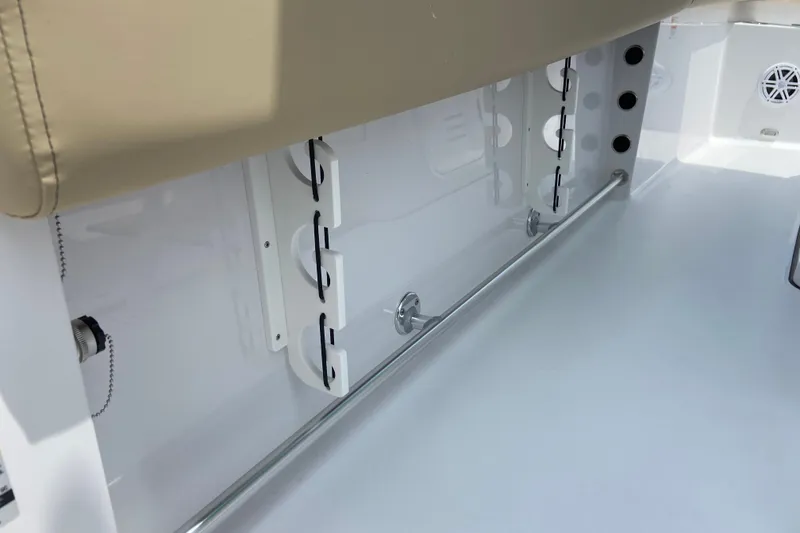 Slide: The Image of 2027 Sportsman Heritage 231 Center Console interior detail with rod holders and seating. - 11
