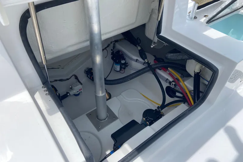 Slide: The Image of 2027 Sportsman Heritage 231 Center Console boat interior wiring and components. - 7