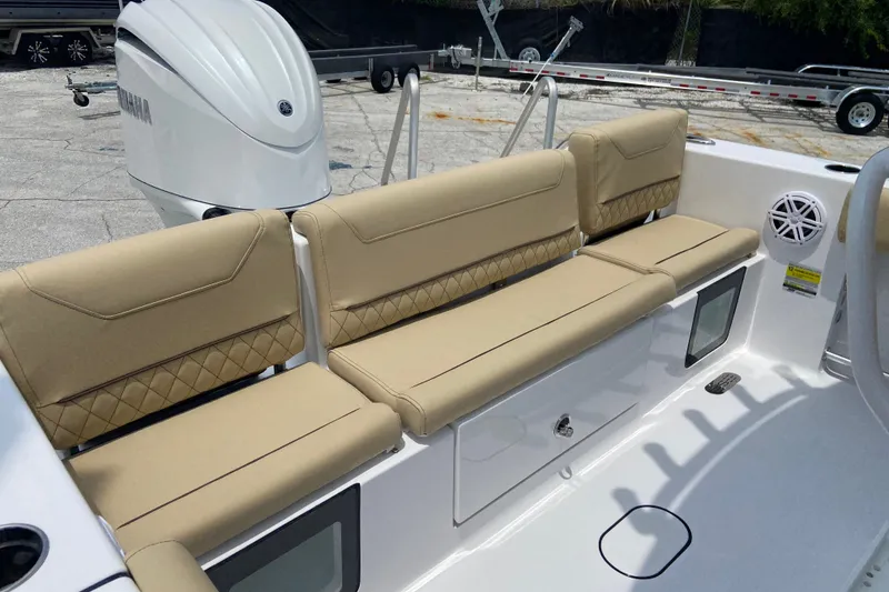 Slide: The Image of 2027 Sportsman Heritage 231 Center Console boat with beige seating and Yamaha engine. - 4