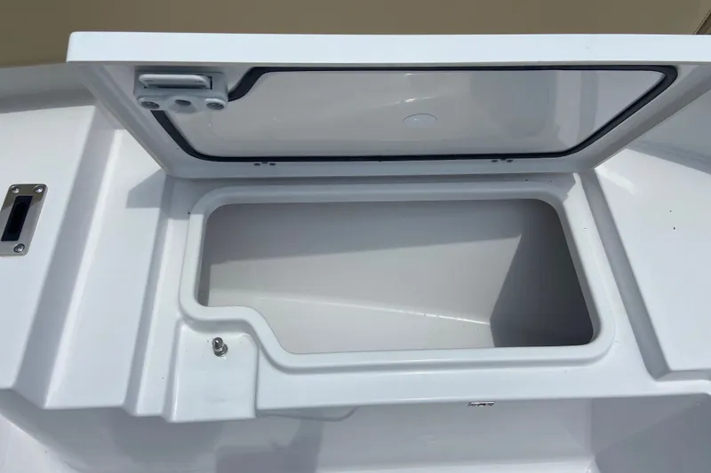 Slide: The Image of Open storage compartment on 2027 Sportsman Heritage 231 Center Console boat. - 24