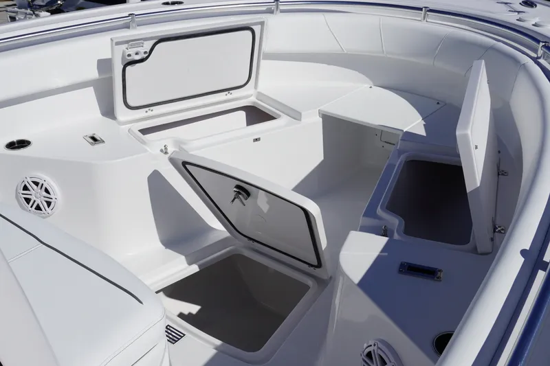 Slide: The Image of 2027 Sportsman Open 232 Center Console boat with open storage compartments. - 13