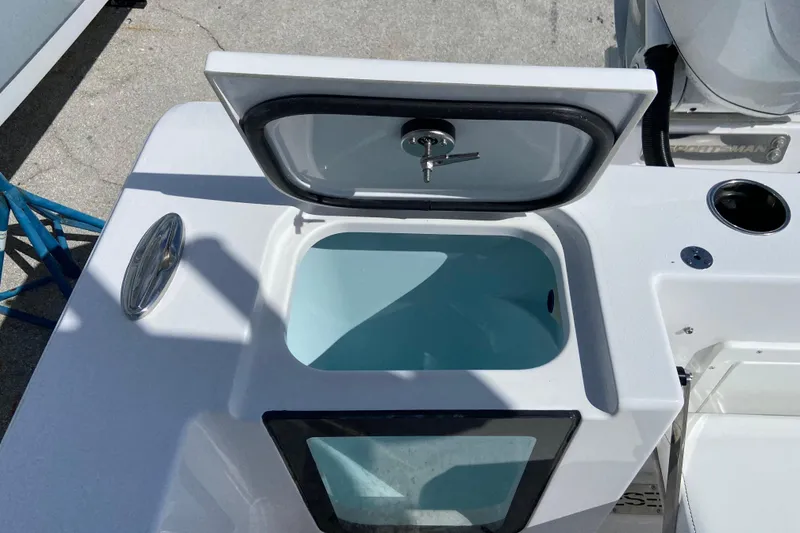 Slide: The Image of Open livewell on 2027 Sportsman Open 232 Center Console boat, showcasing interior design. - 3