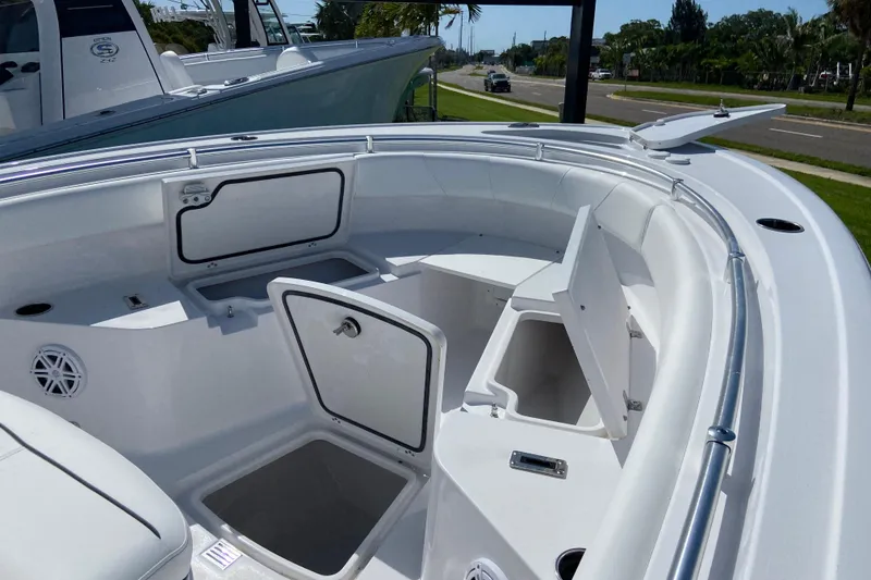 Slide: The Image of 2027 Sportsman Open 232 Center Console boat interior with storage compartments and seating. - 19
