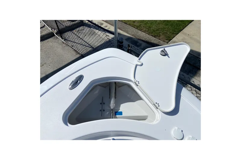 Slide: The Image of Open storage compartment on 2027 Sportsman Open 232 Center Console boat. - 23