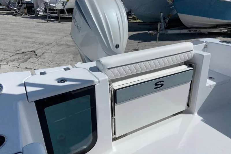 Slide: The Image of 2027 Sportsman Open 232 Center Console boat with sleek seating and storage features. - 4