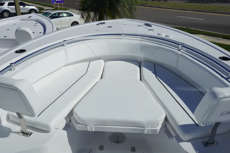 Slide: The Image of 2027 Sportsman Open 232 Center Console boat with spacious white seating area. - 17