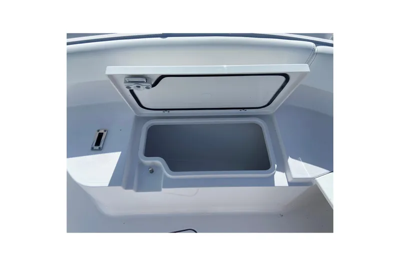 Slide: The Image of Open storage compartment on 2027 Sportsman Open 232 Center Console boat. - 21
