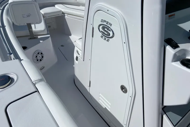 Slide: The Image of 2027 Sportsman Open 232 Center Console boat interior with seating and storage. - 25