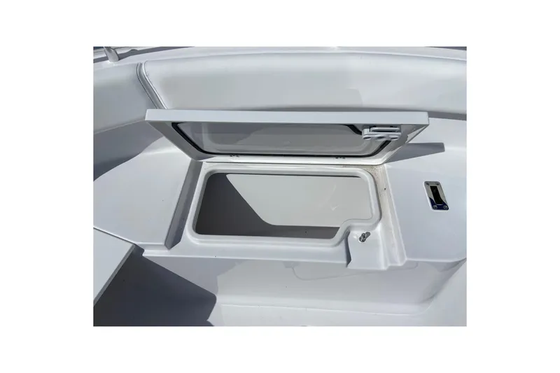 Slide: The Image of Open storage compartment on 2027 Sportsman Open 232 Center Console boat. - 22