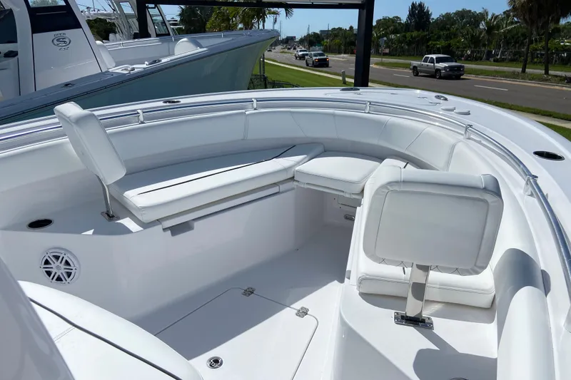 Slide: The Image of 2027 Sportsman Open 232 Center Console boat with white seating and sleek design. - 24