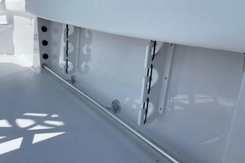 Slide: The Image of 2027 Sportsman Open 232 Center Console interior detail, showcasing rod holders and sleek design. - 10