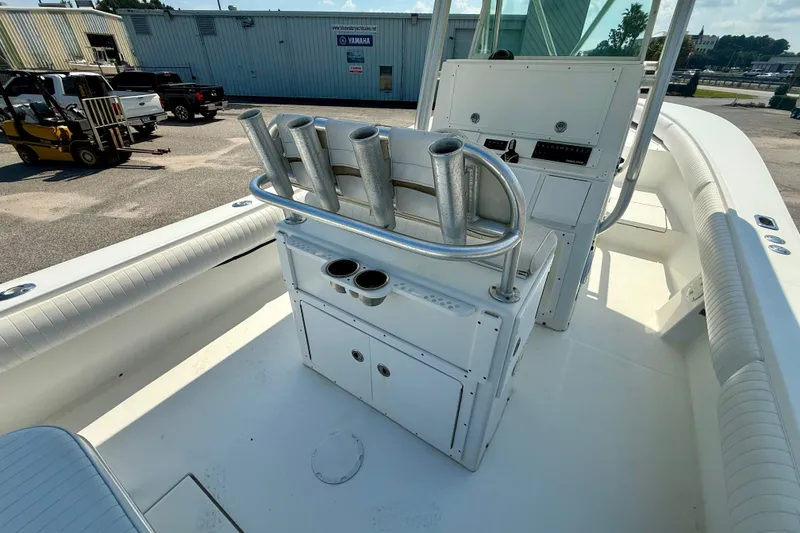 Slide: The Image of 2007 Regulator 29 Forward Seating boat interior with rod holders and console. - 11