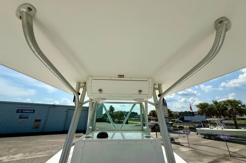Slide: The Image of 2007 Regulator 29 Forward Seating boat with T-top and storage compartment. - 13