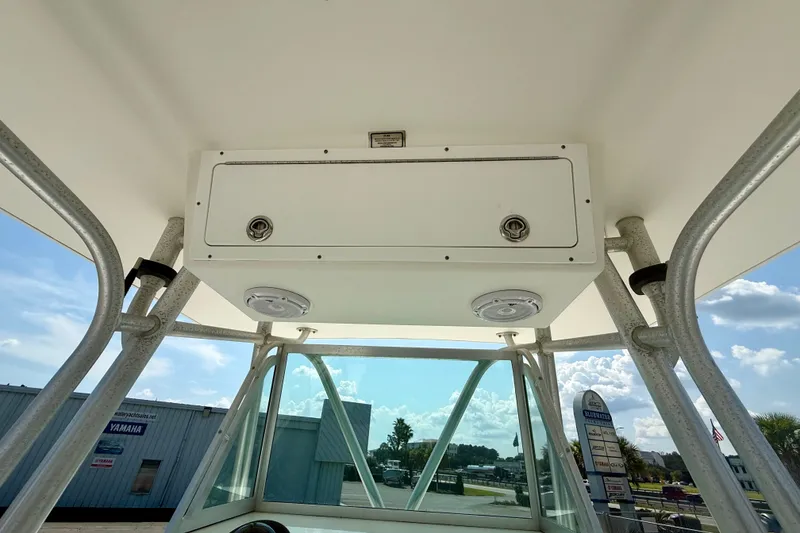 Slide: The Image of 2007 Regulator 29 Forward Seating boat console with storage compartment and overhead view. - 14