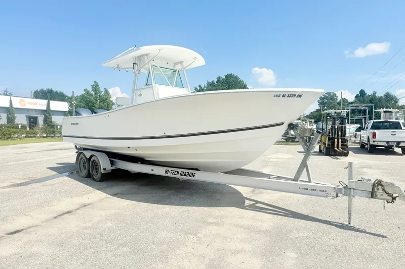 Slide: The Image of 2007 Regulator 29 Forward Seating boat on trailer in parking lot. - 0