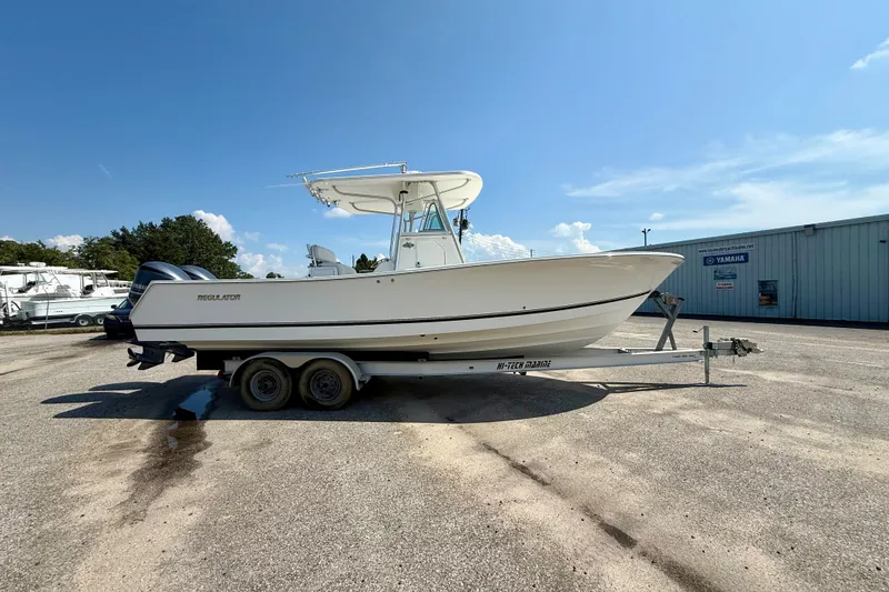 Slide: The Image of 2007 Regulator 29 Forward Seating boat on trailer in sunny outdoor setting. - 5