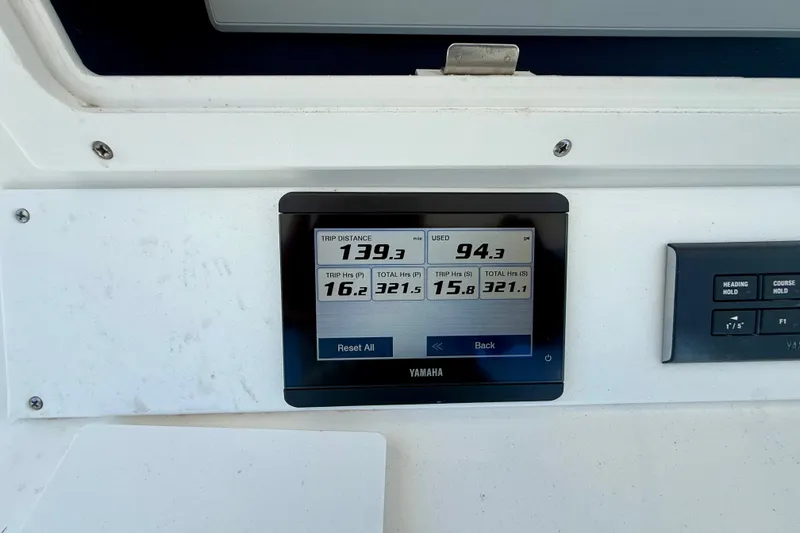 Slide: The Image of Yamaha display on 2007 Regulator 29 Forward Seating boat showing trip data and fuel usage. - 24
