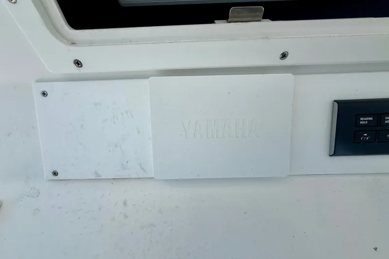 Slide: The Image of Control panel on a 2007 Regulator 29 Forward Seating boat with Yamaha branding. - 17